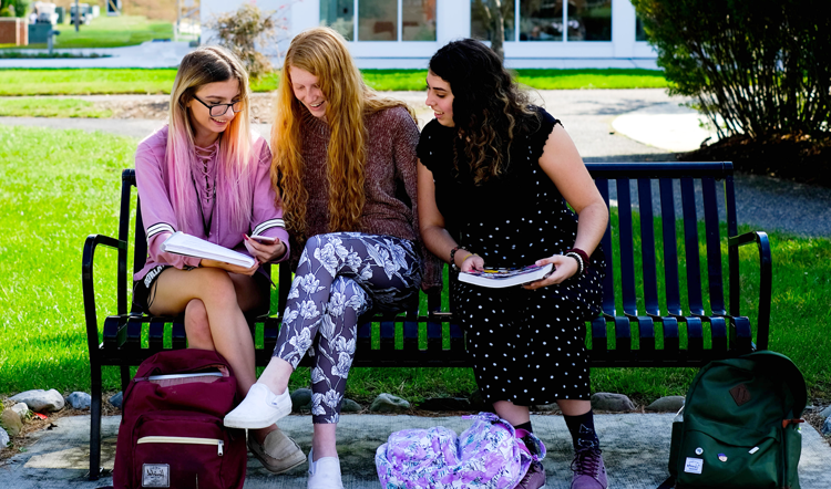 hongjiuchina.com three female students studying on a bench on camp at Ocean County College